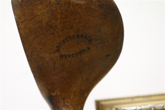 Two wooden drivers by Armstrong & Co and Paxton, a gun metal putto signed Jacques, 7 other and a golf ball